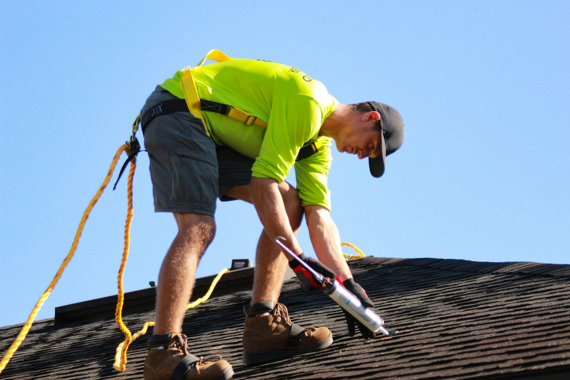 man sealing roof