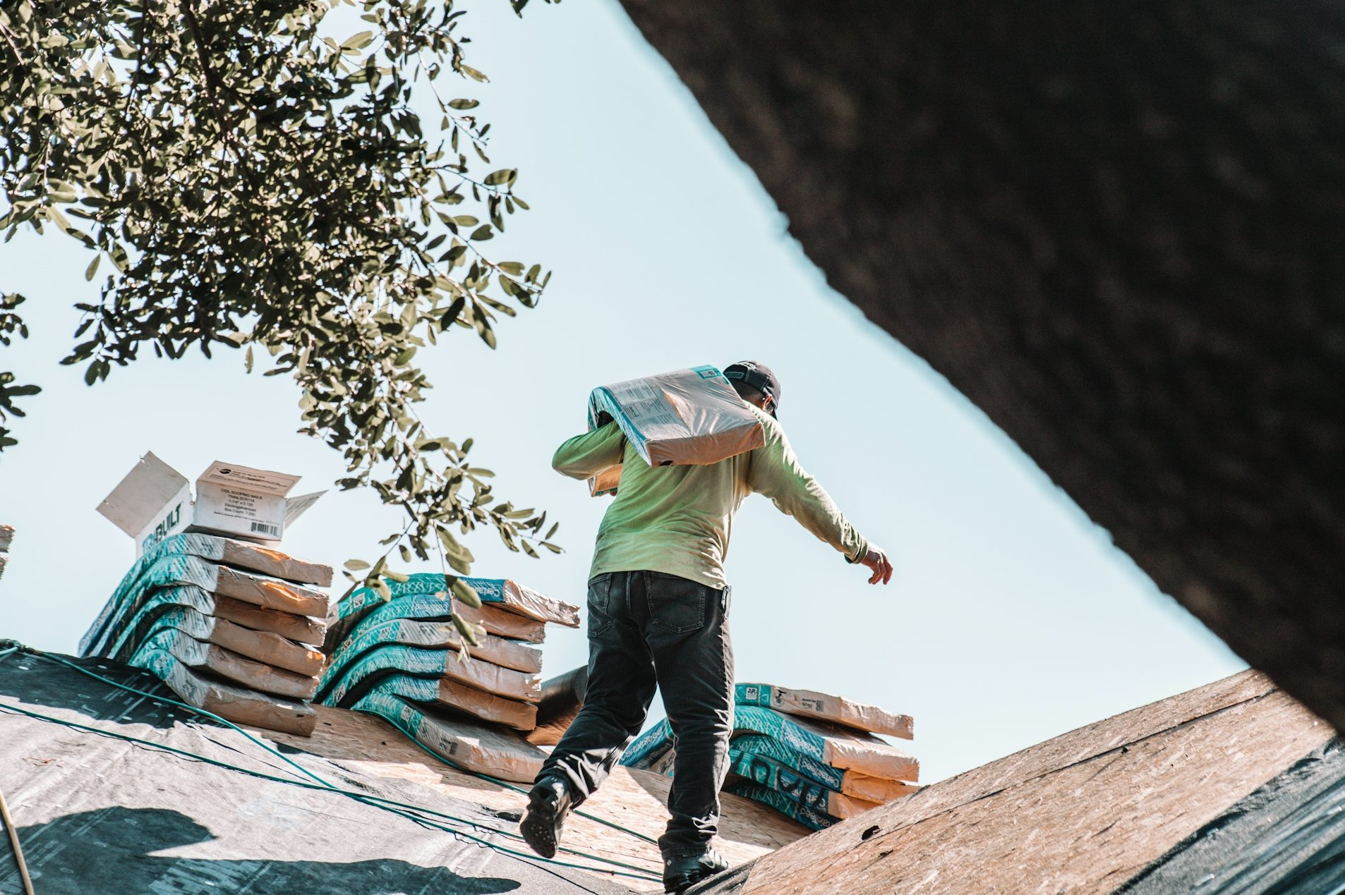 man sealing roof